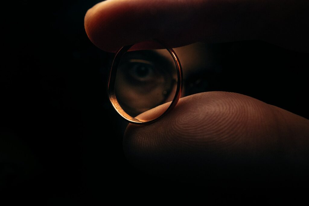 A ring reflects an eye.